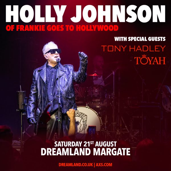 Holly Johnson on stage with his name in bold font